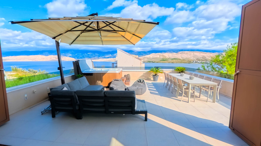 Modern open-plan living room with sea view in Pag villa