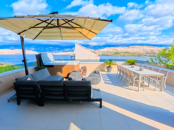 Modern open-plan living room with sea view in Pag villa