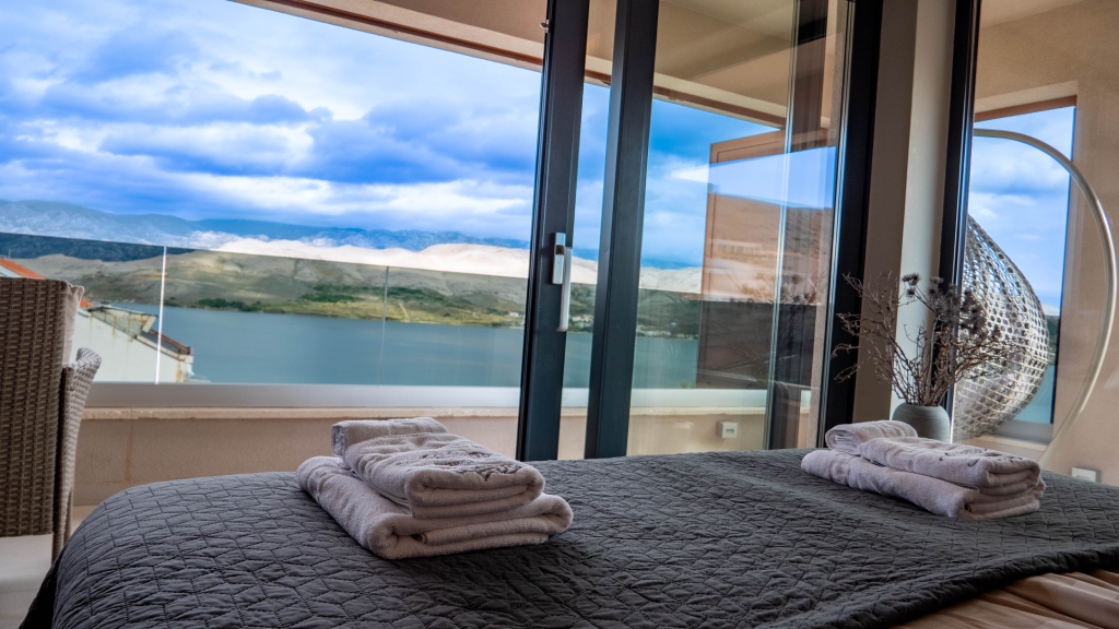 Elegant master suite with panoramic sea view in contemporary villa Pag