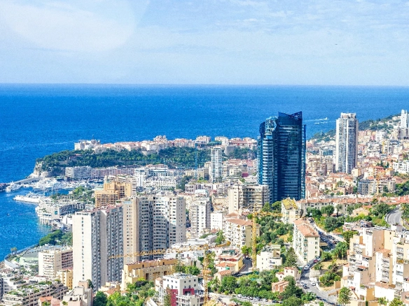 Panoramic view of luxury real estate in Monaco overlooking the Mediterranean Sea.