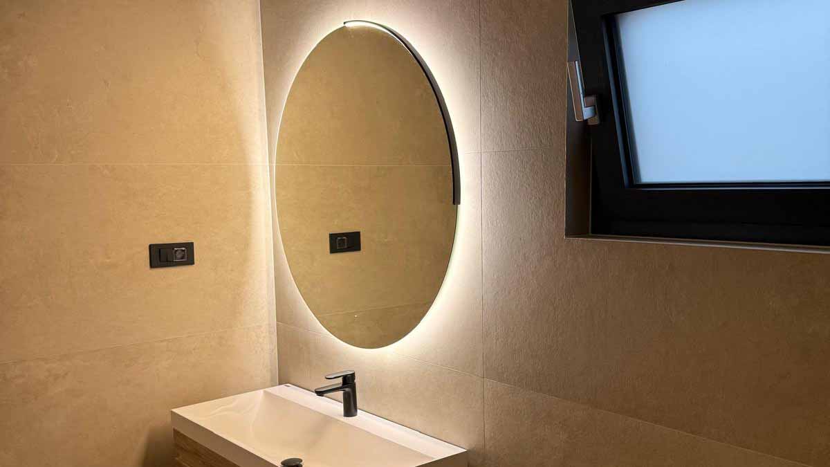 Elegant modern bathroom with minimalist design and illuminated mirror in luxury villa Zadar Croatia