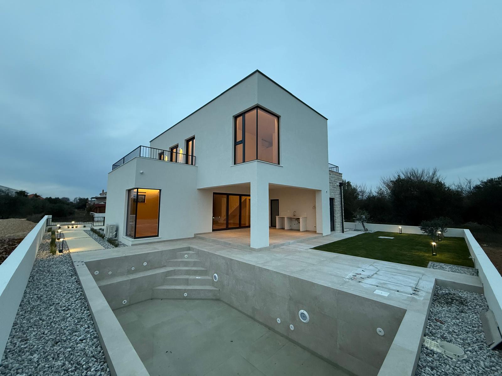 Private swimming pool of modern luxury villa in Zadar Croatia near the Adriatic Sea with minimalist design